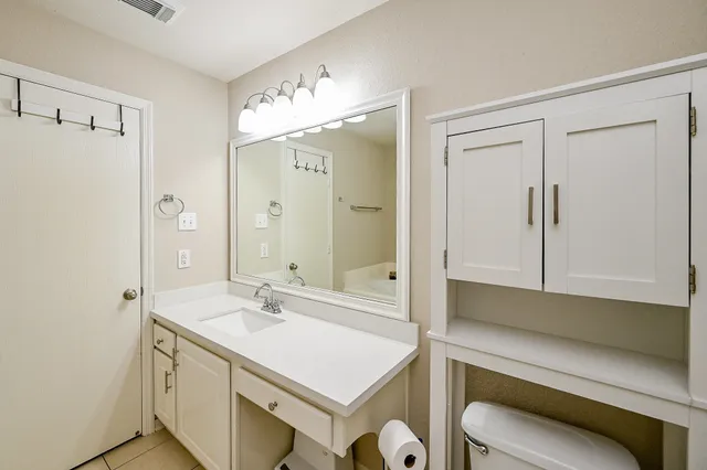 a bathroom with a sink a mirror and a shower