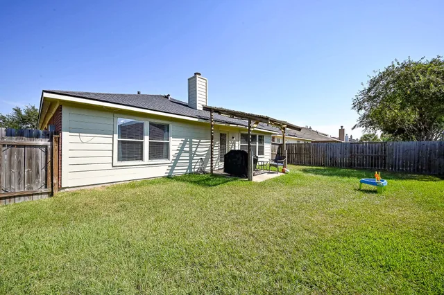 a front view of a house with yard