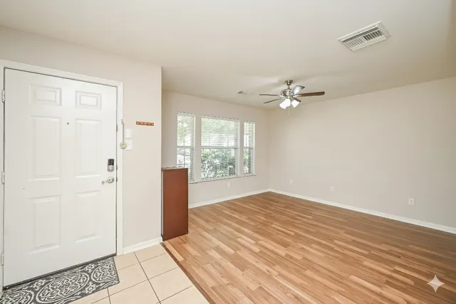 a view of an empty room with a window