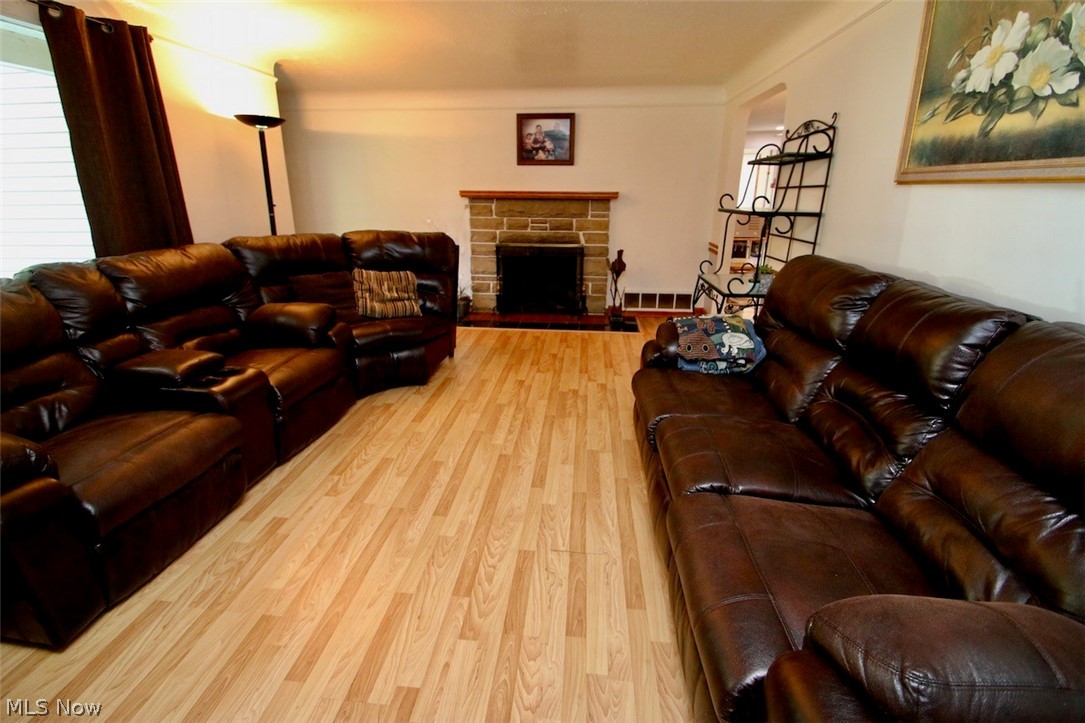 3 Nepahwin Road Timberlake, OH 44095 - Photo 12 of 22 Living room with large picture window and charming fireplace. You will appreciate the size of this room.