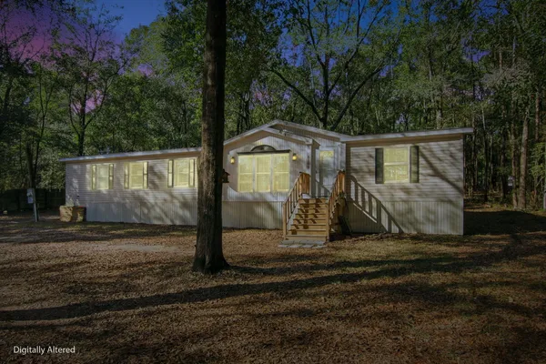 a view of a back yard of the house