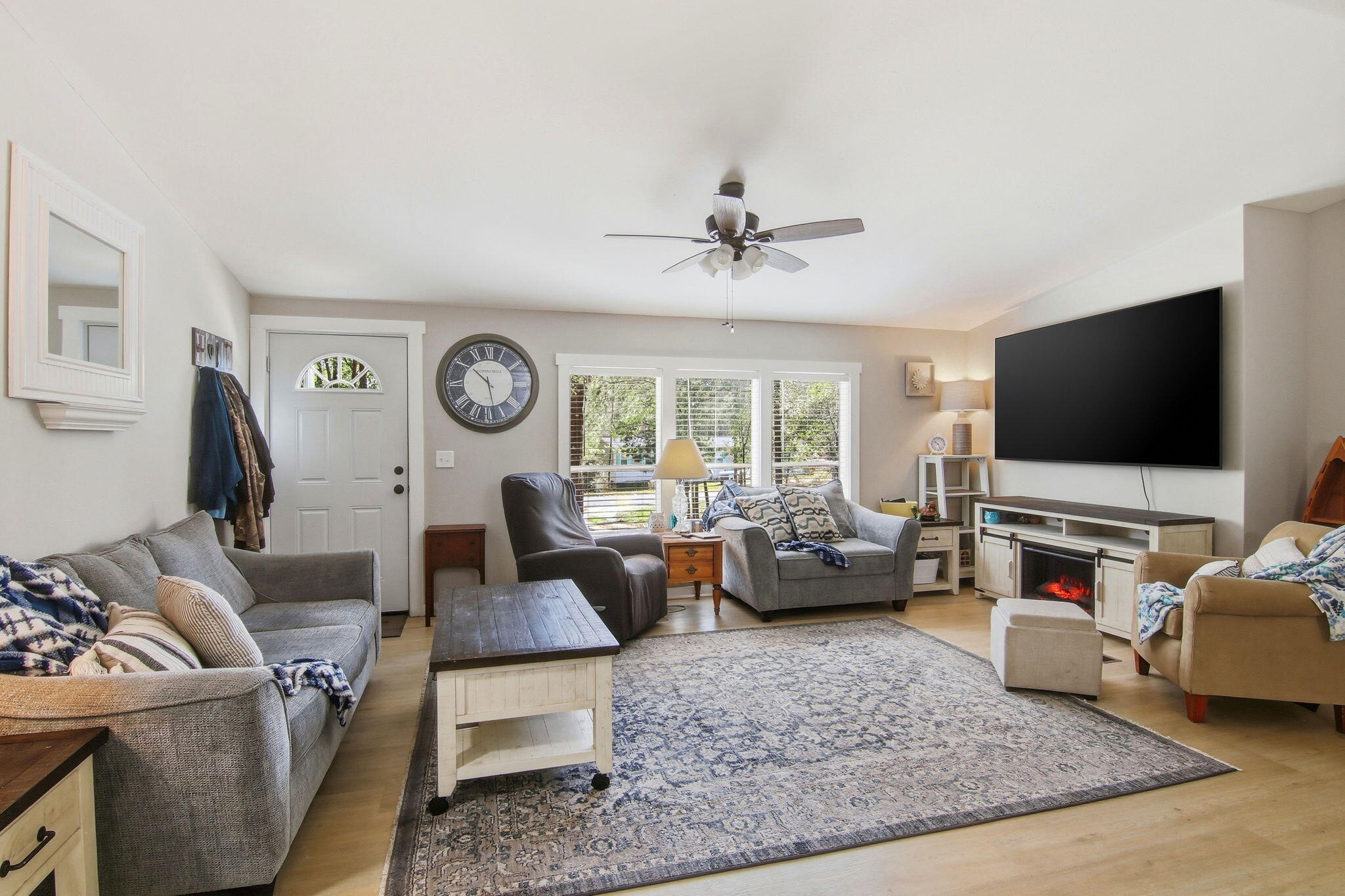6108 Old River Road Baker, FL 32531 - Photo 13 of 40 a living room with furniture and a flat screen tv