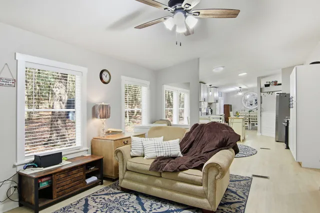 a living room with furniture and a window