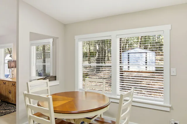 a view of a room with a furniture and windows
