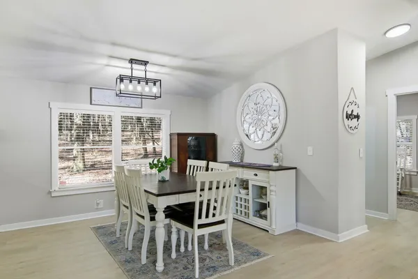 a view of a very nice looking dining room with a window