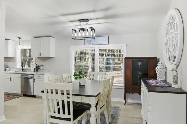 a view of a dining room with furniture window and outside view