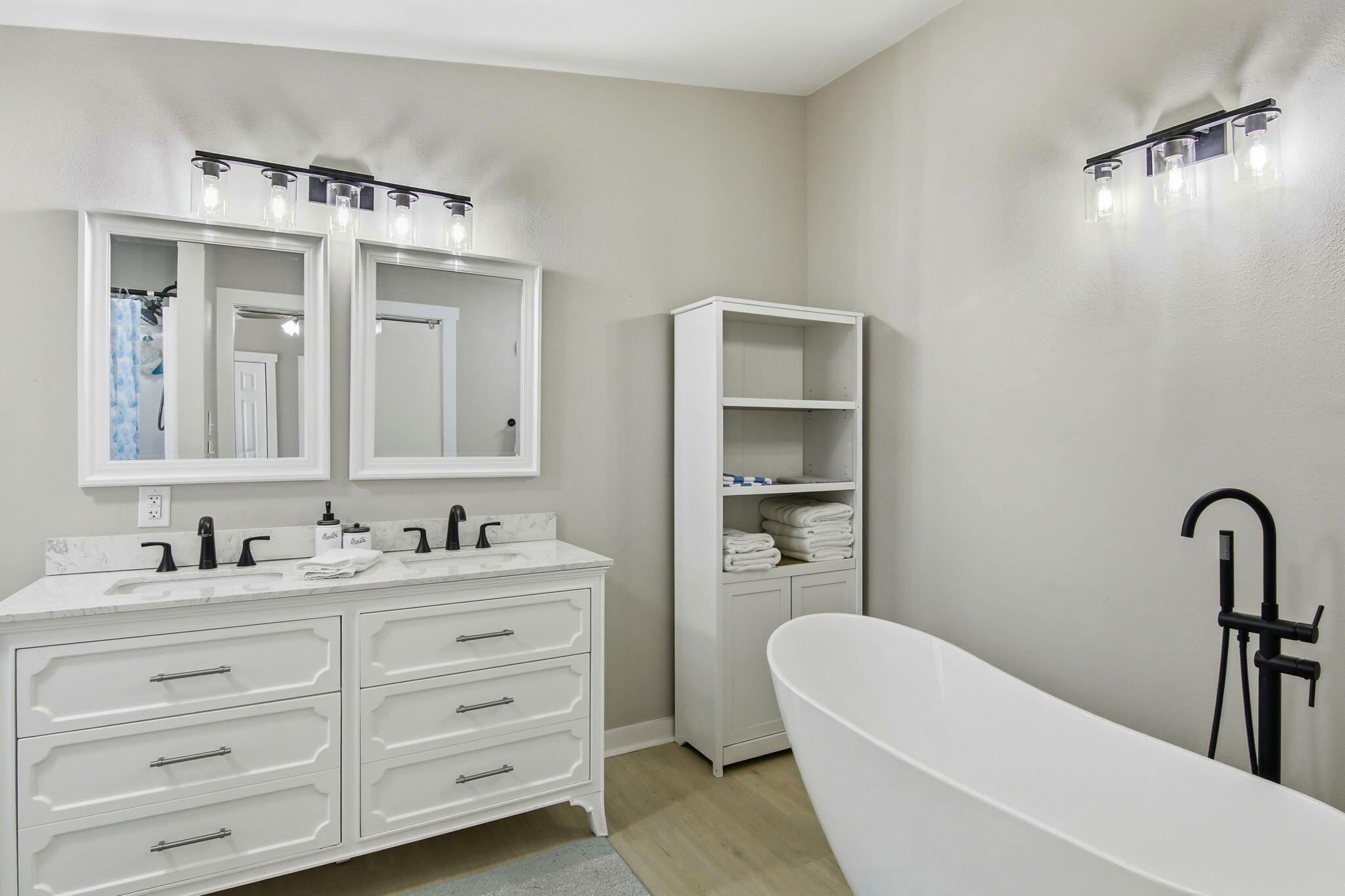 6108 Old River Road Baker, FL 32531 - Photo 31 of 40 a bathroom with a double vanity sink mirror and bathtub