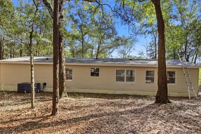 a house view with a backyard space