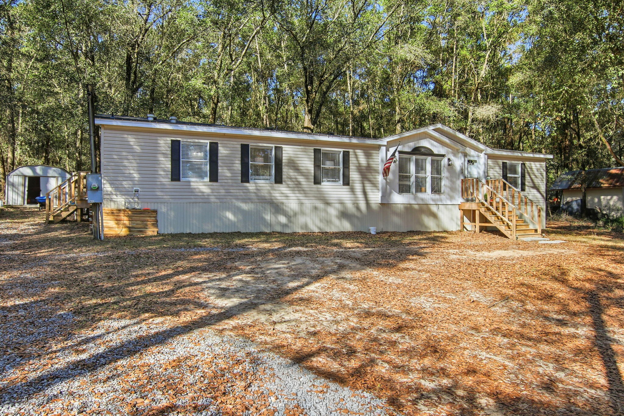 6108 Old River Road Baker, FL 32531 - Photo 7 of 40 a front view of a house with a yard