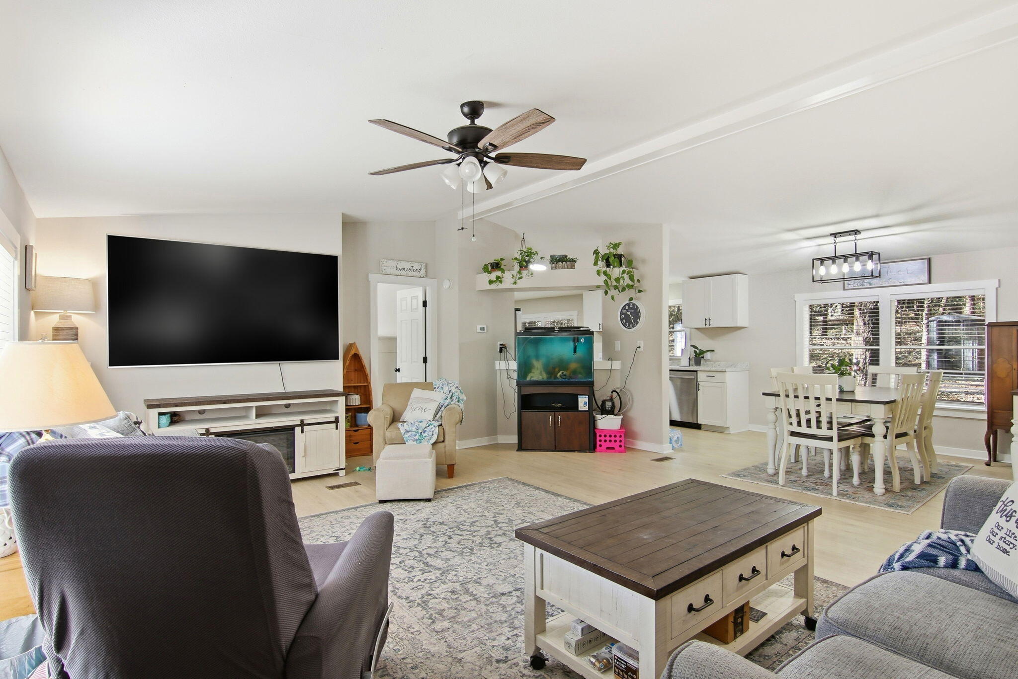 6108 Old River Road Baker, FL 32531 - Photo 10 of 40 a living room with furniture and a flat screen tv