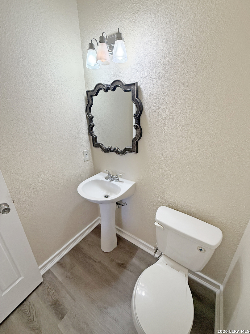 9808 Delta Ridge Drive Converse, TX 78109 - Photo 18 of 38 a bathroom with a toilet sink and mirror