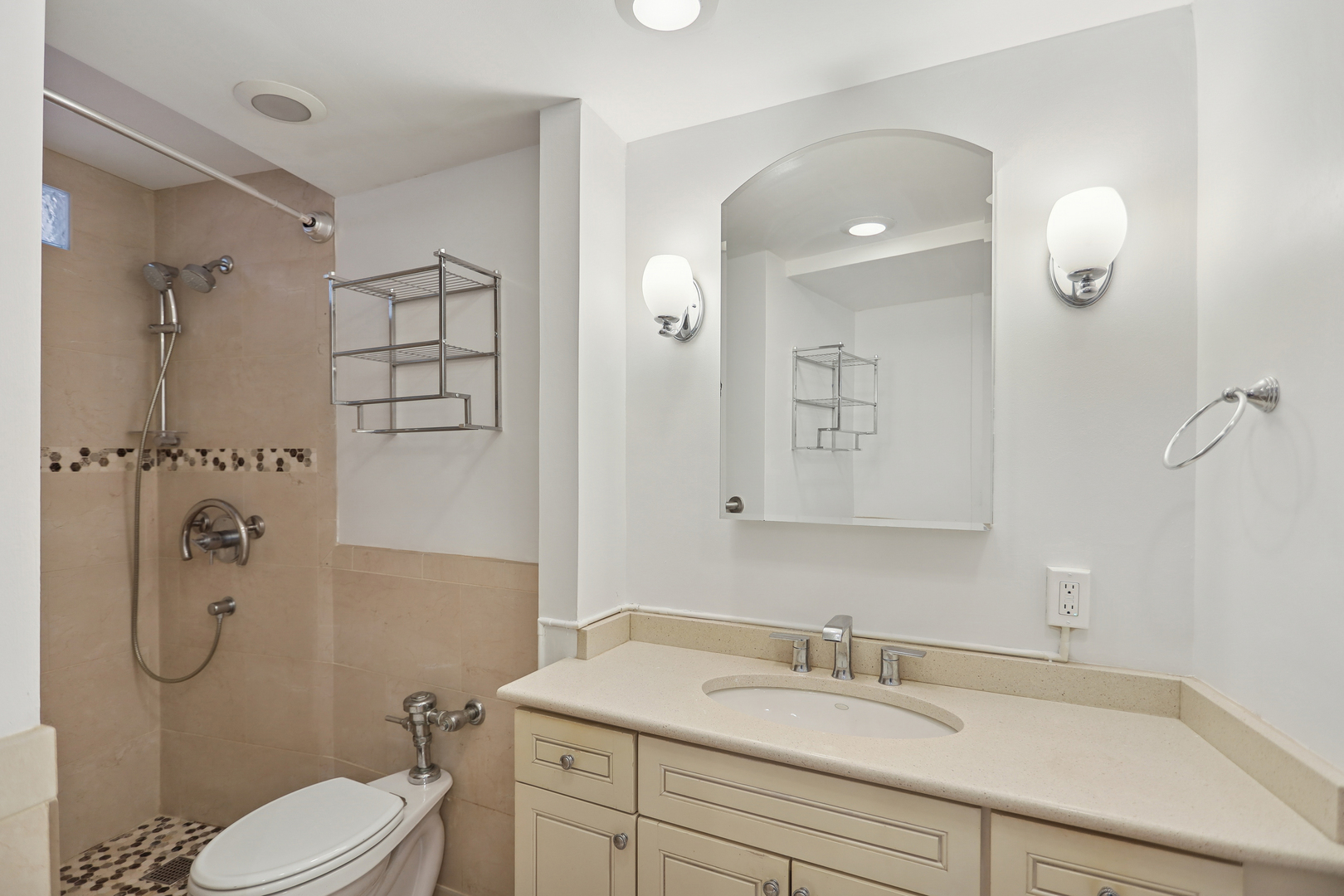 300 North State Street, Unit 5803 Chicago, IL 60654 - Photo 9 of 18 a bathroom with a sink toilet and shower