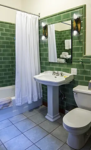 a bathroom with a sink toilet and tub