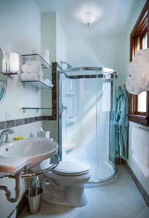 a bathroom with a sink toilet and shower