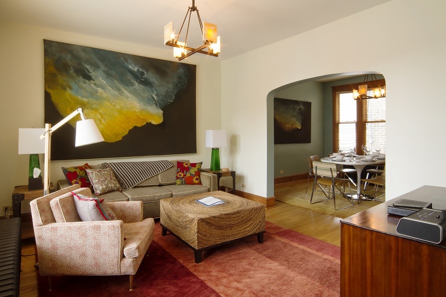 2134 North Damen Avenue, Unit 2 Chicago, IL 60647 - Photo 3 of 22 a living room with furniture a chandelier and a wooden floor