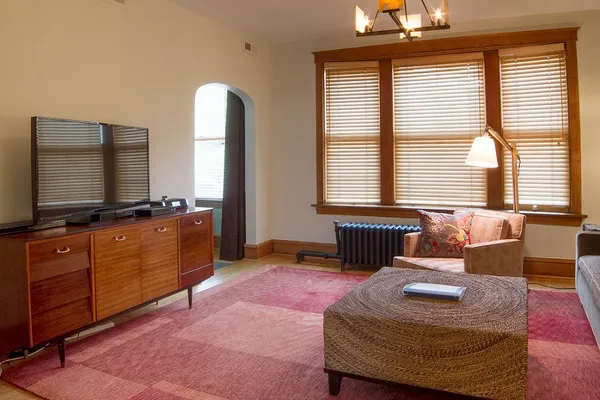 a living room with furniture and a flat screen tv