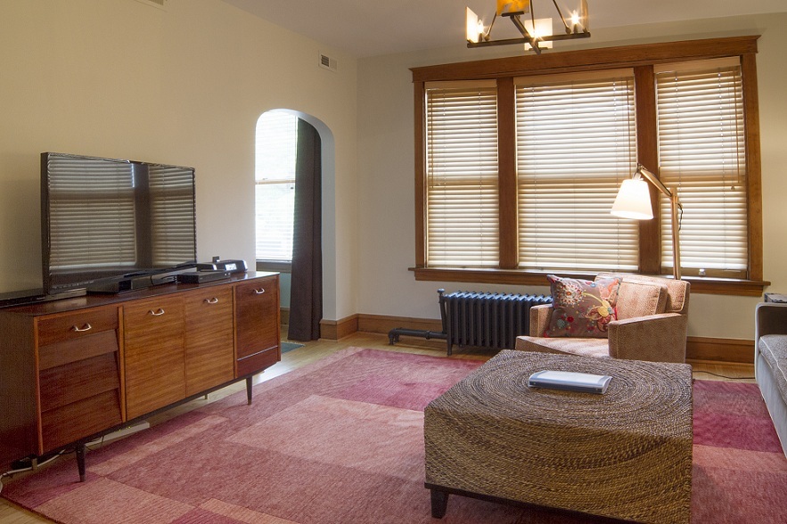 2134 North Damen Avenue, Unit 2 Chicago, IL 60647 - Photo 4 of 22 a living room with furniture and a flat screen tv