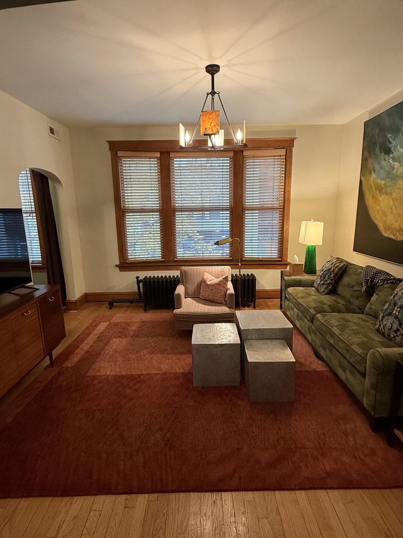 2134 North Damen Avenue, Unit 2 Chicago, IL 60647 - Photo 5 of 22 a living room with furniture and a large window