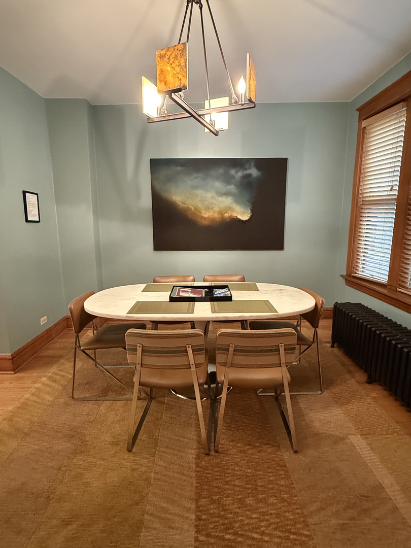 2134 North Damen Avenue, Unit 2 Chicago, IL 60647 - Photo 7 of 22 a dining room with furniture and window