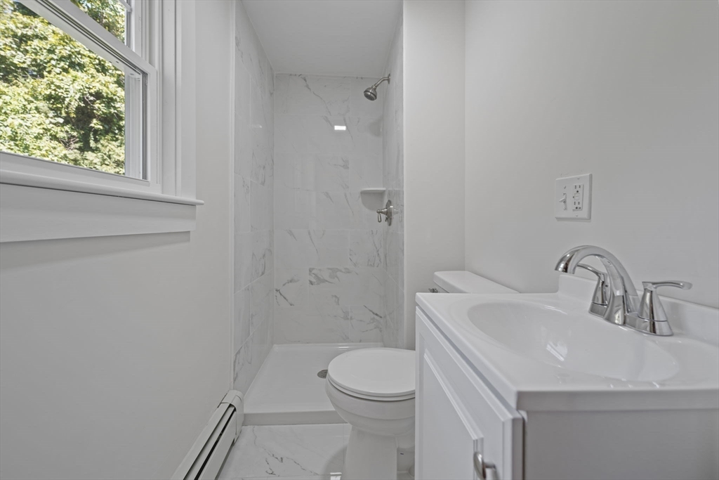 282 Parker Road Barnstable, MA 02668 - Photo 12 of 17 a bathroom with a sink a toilet and shower