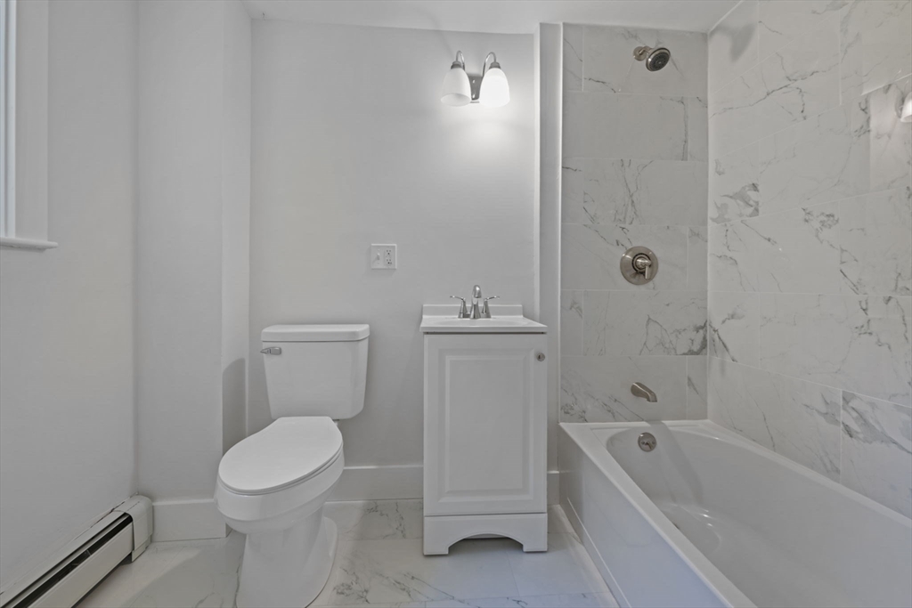 282 Parker Road Barnstable, MA 02668 - Photo 15 of 17 a bathroom with a toilet a sink and bathtub