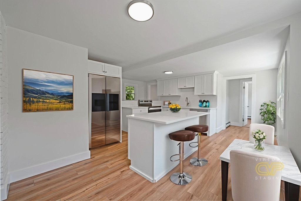 282 Parker Road Barnstable, MA 02668 - Photo 4 of 17 a kitchen view with granite countertop a sink cabinets and stainless steel appliances
