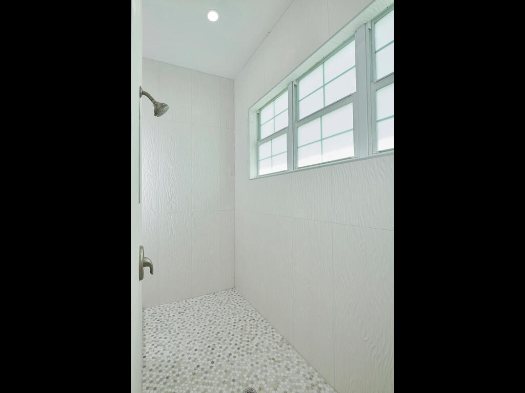 3677 Oil Well Road Naples, FL 34120 - Photo 13 of 28 a view of an empty room with a window