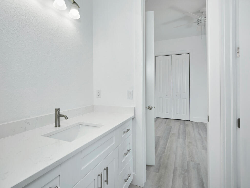 3677 Oil Well Road Naples, FL 34120 - Photo 15 of 28 a bathroom with a sink and a mirror