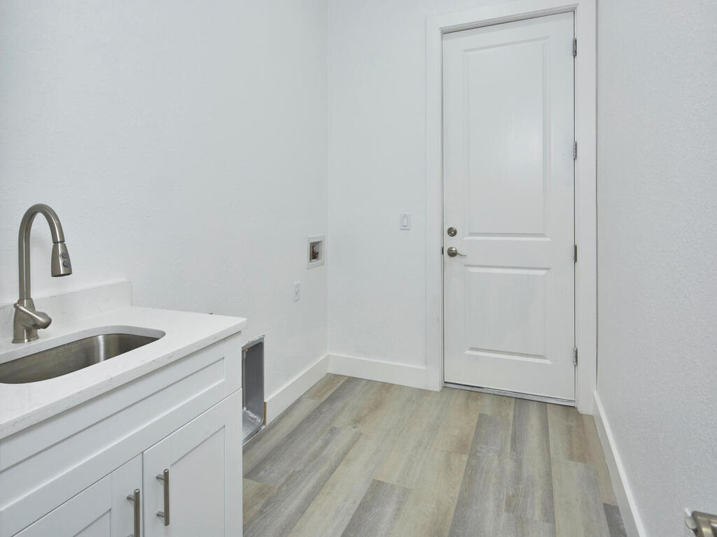 3677 Oil Well Road Naples, FL 34120 - Photo 19 of 28 a view of a kitchen from the hallway
