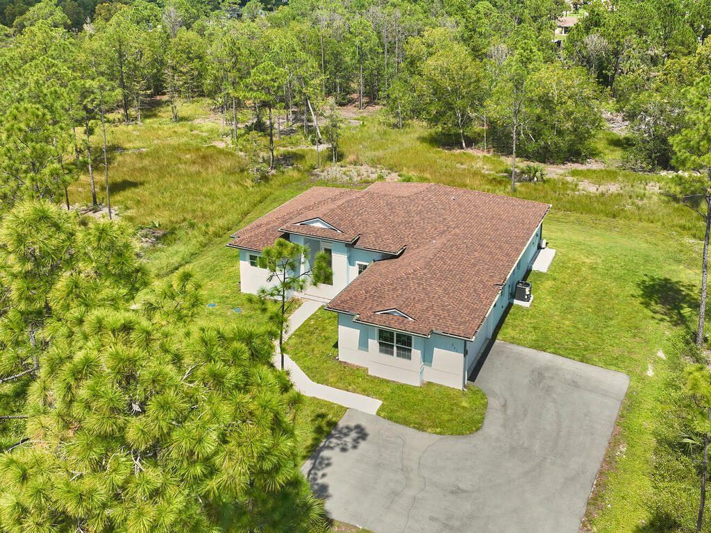 3677 Oil Well Road Naples, FL 34120 - Photo 2 of 28 an aerial view of a house