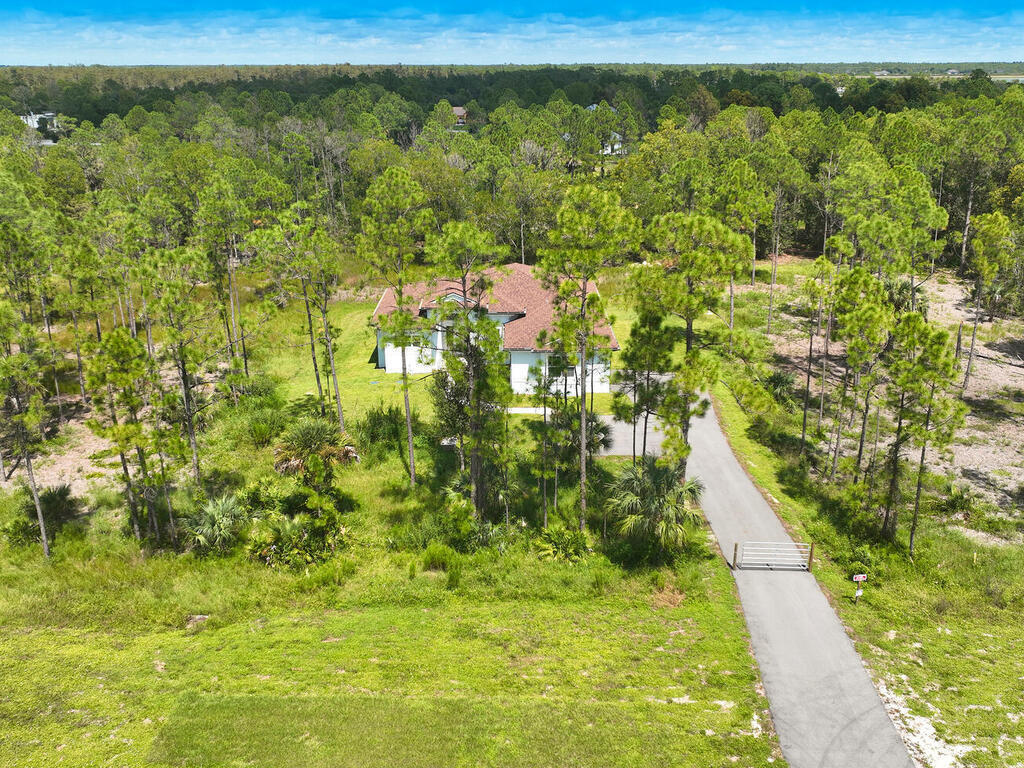 3677 Oil Well Road Naples, FL 34120 - Photo 23 of 28 a view of a yard with an outdoor space