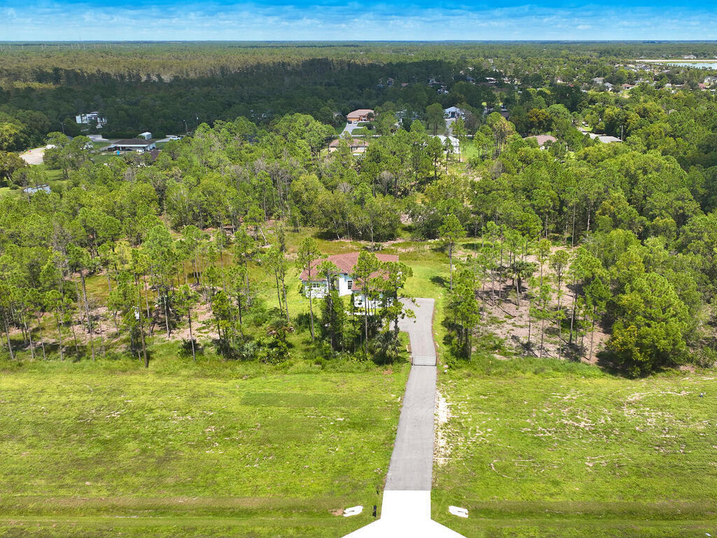 3677 Oil Well Road Naples, FL 34120 - Photo 24 of 28 a view of a lake with houses