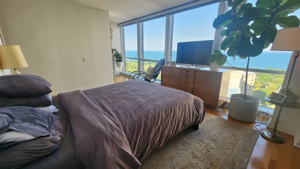 a bedroom with a bed and window