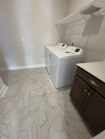 a bathroom with a sink vanity and toilet