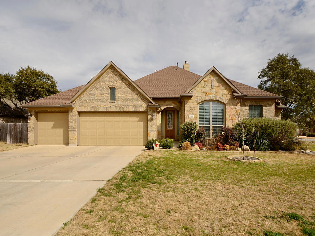 185 Elderberry Road Austin, TX 78737 - Photo 1 of 1 a front view of a house with a yard and garage