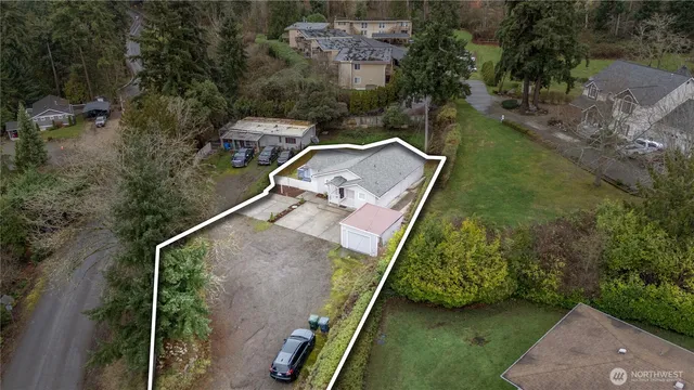 an aerial view of a house with a yard
