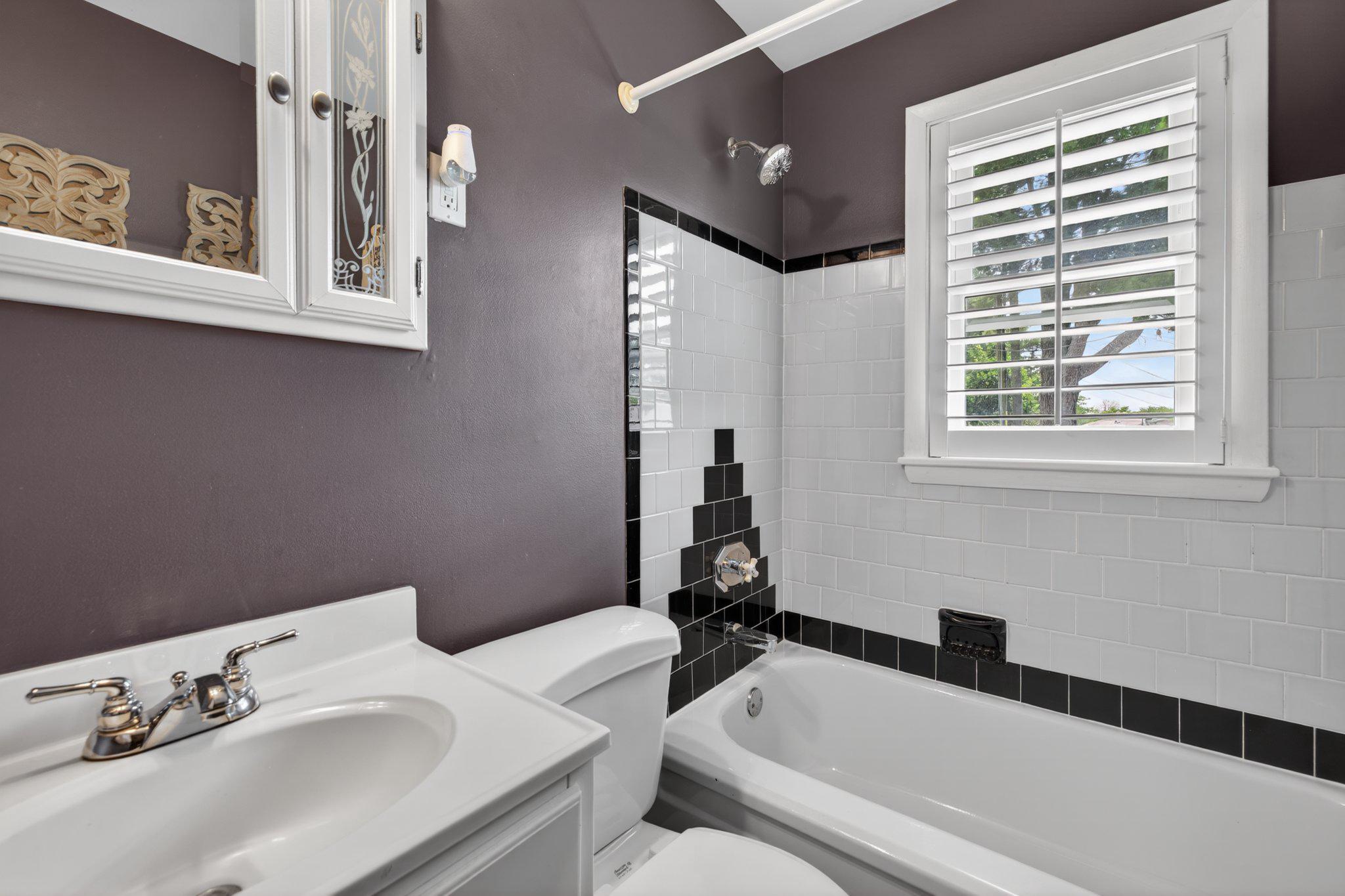 1002 Wilson Place Frederick, MD 21702 - Photo 14 of 30 a bathroom with a sink and a bathtub