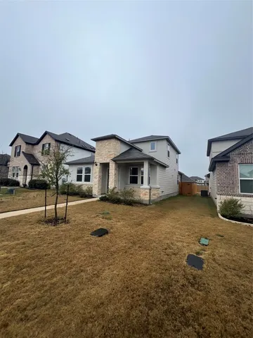 a house view with a backyard space