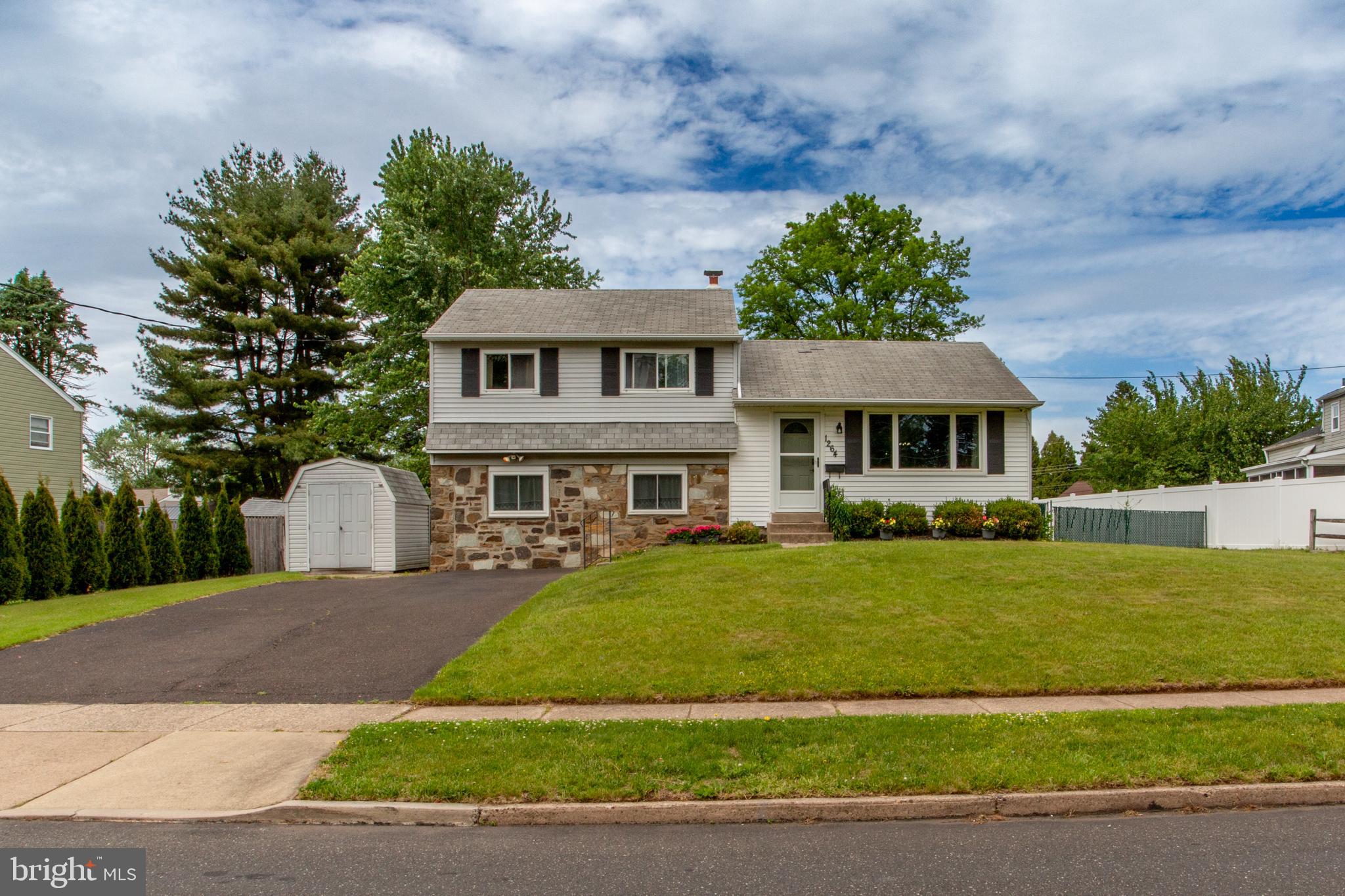 1264 Tulip Road Warminster, PA 18974 - Photo 1 of 21 a front view of a house with a yard