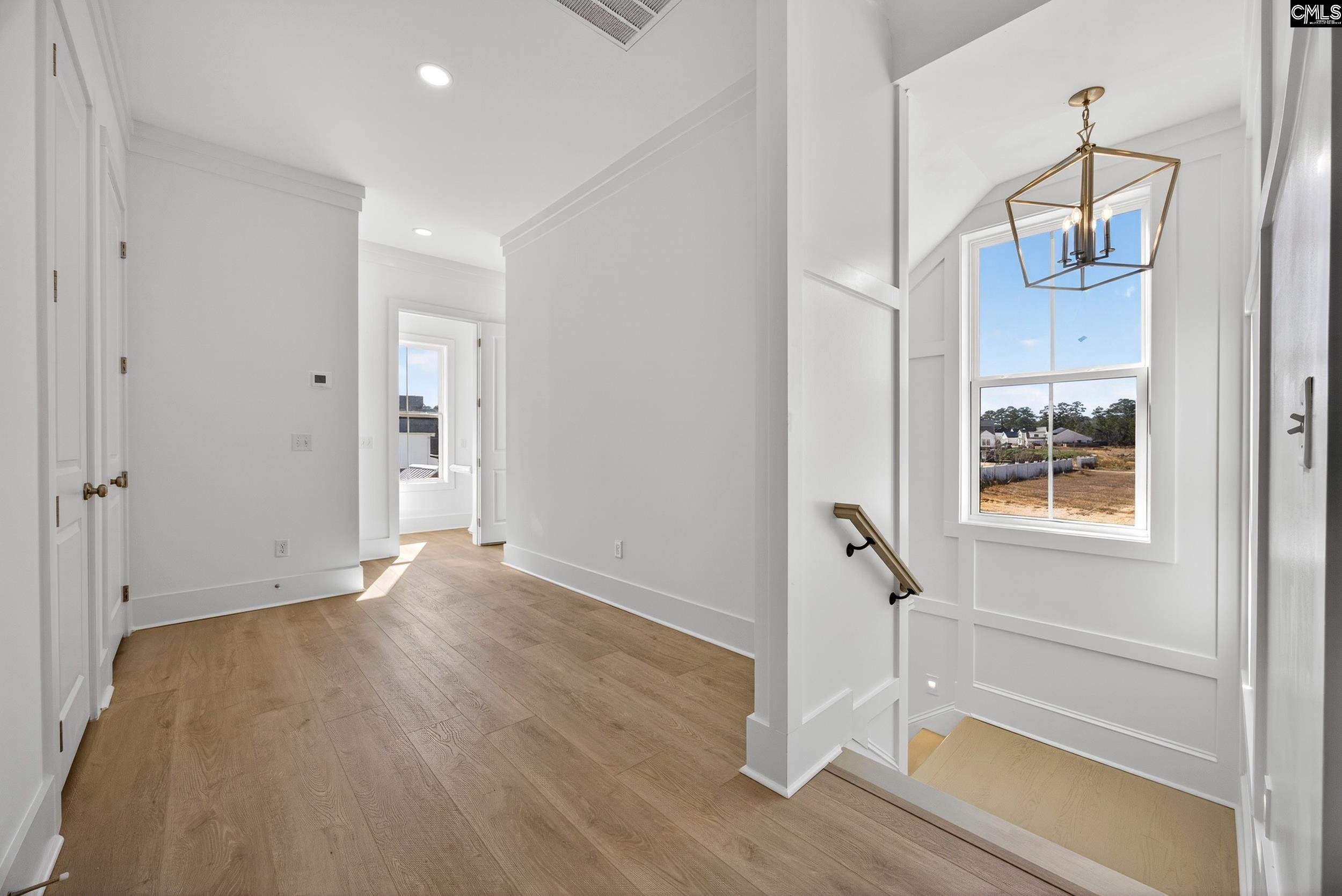 1318 Long Grove Way Lexington, SC 29072 - Photo 63 of 90 a view of empty room with wooden floor and fan