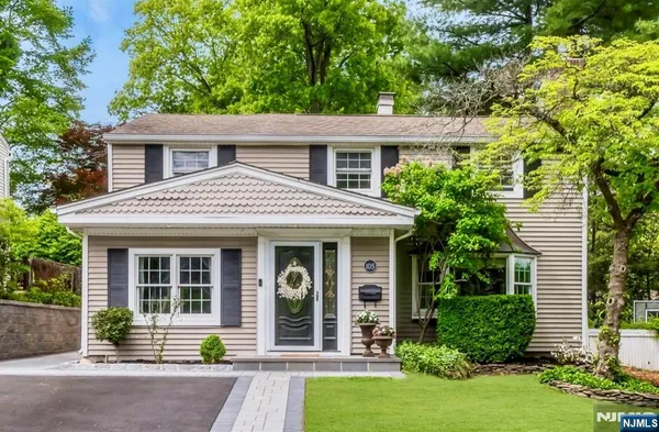 front view of a house that has a small yard