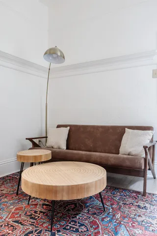 a living room with furniture and a rug