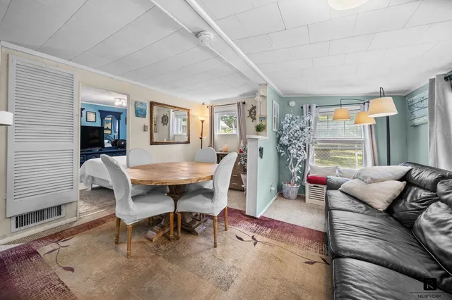 a view of a patio with chair and tables back yard of the house