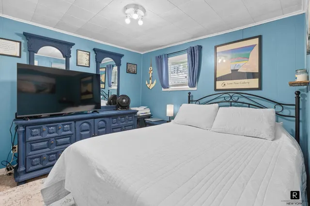 a living room with furniture a wooden floor and a window