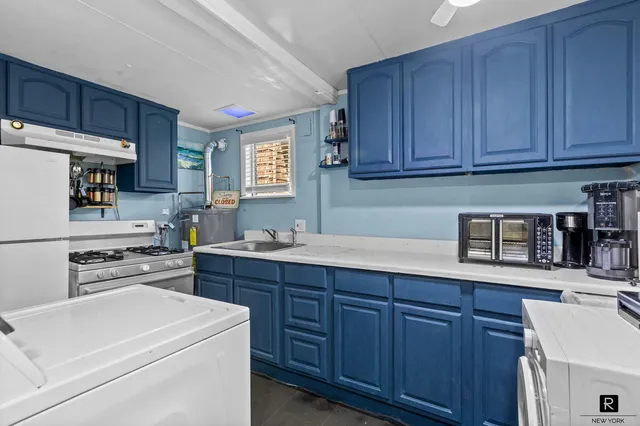 a view of a dining room with furniture and window