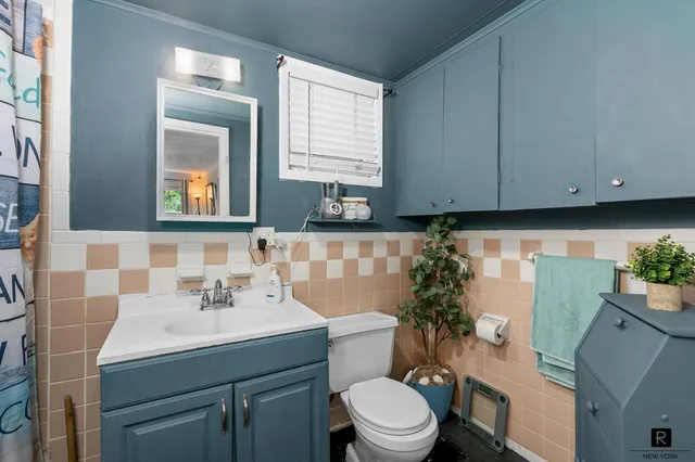 a kitchen with a sink and wooden cabinets