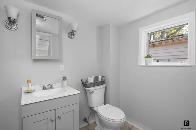 a kitchen with stainless steel appliances a sink stove and refrigerator