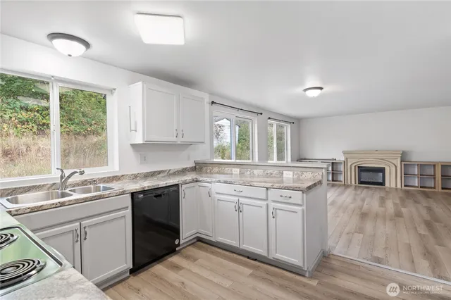 a kitchen with a sink stove and cabinets