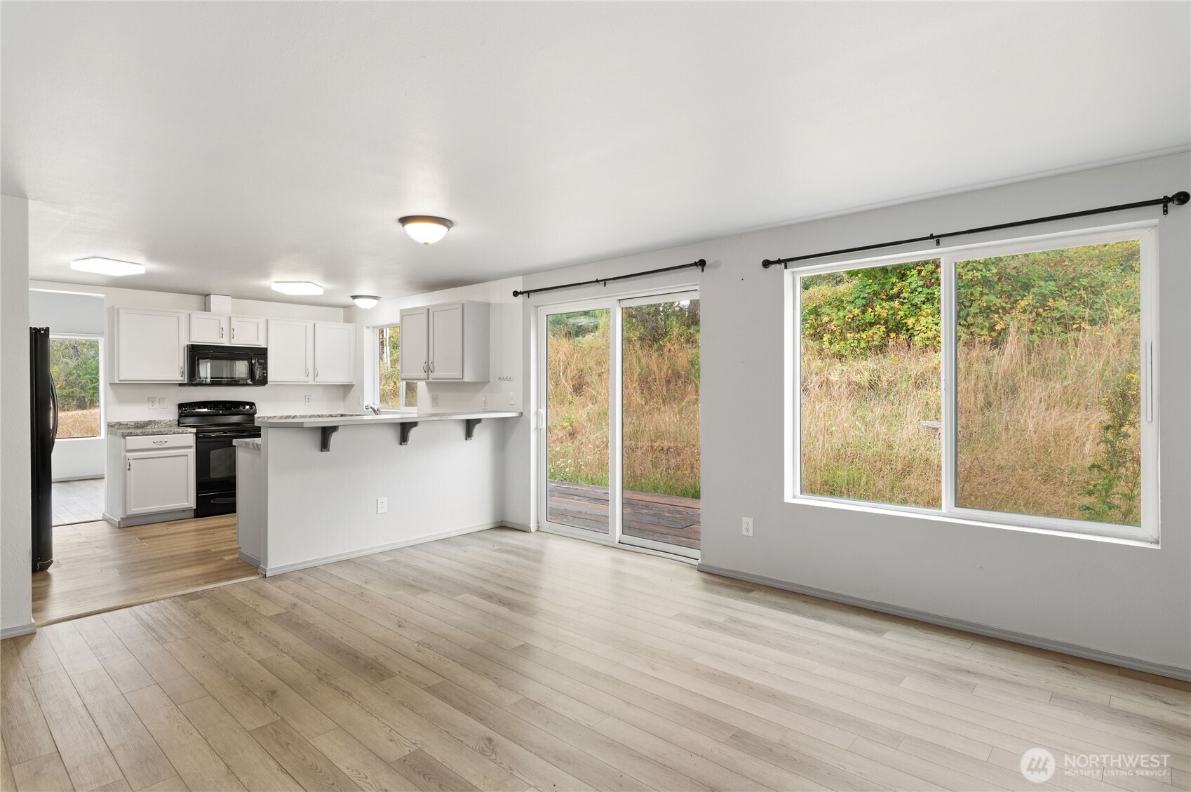 5151 East Pickering Road Shelton, WA 98584 - Photo 14 of 27 a view of kitchen with wooden floor and electronic appliances