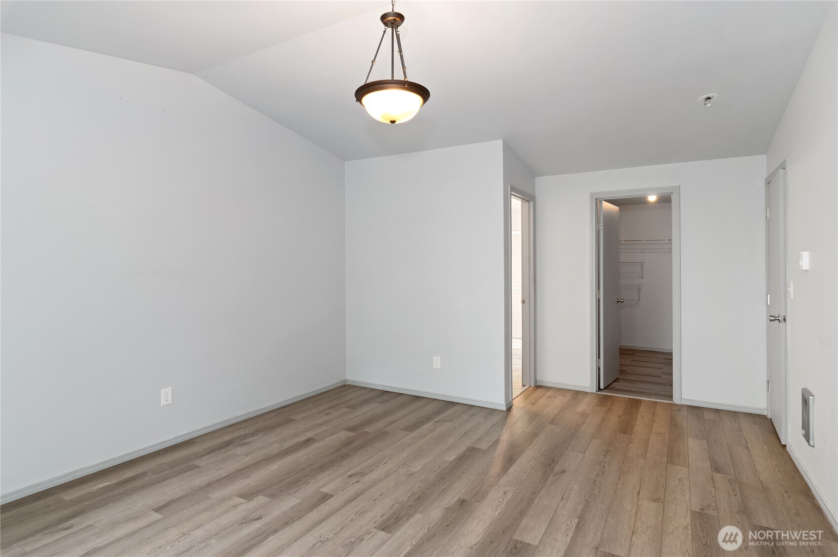5151 East Pickering Road Shelton, WA 98584 - Photo 17 of 27 a view of a room with wooden floor and white walls